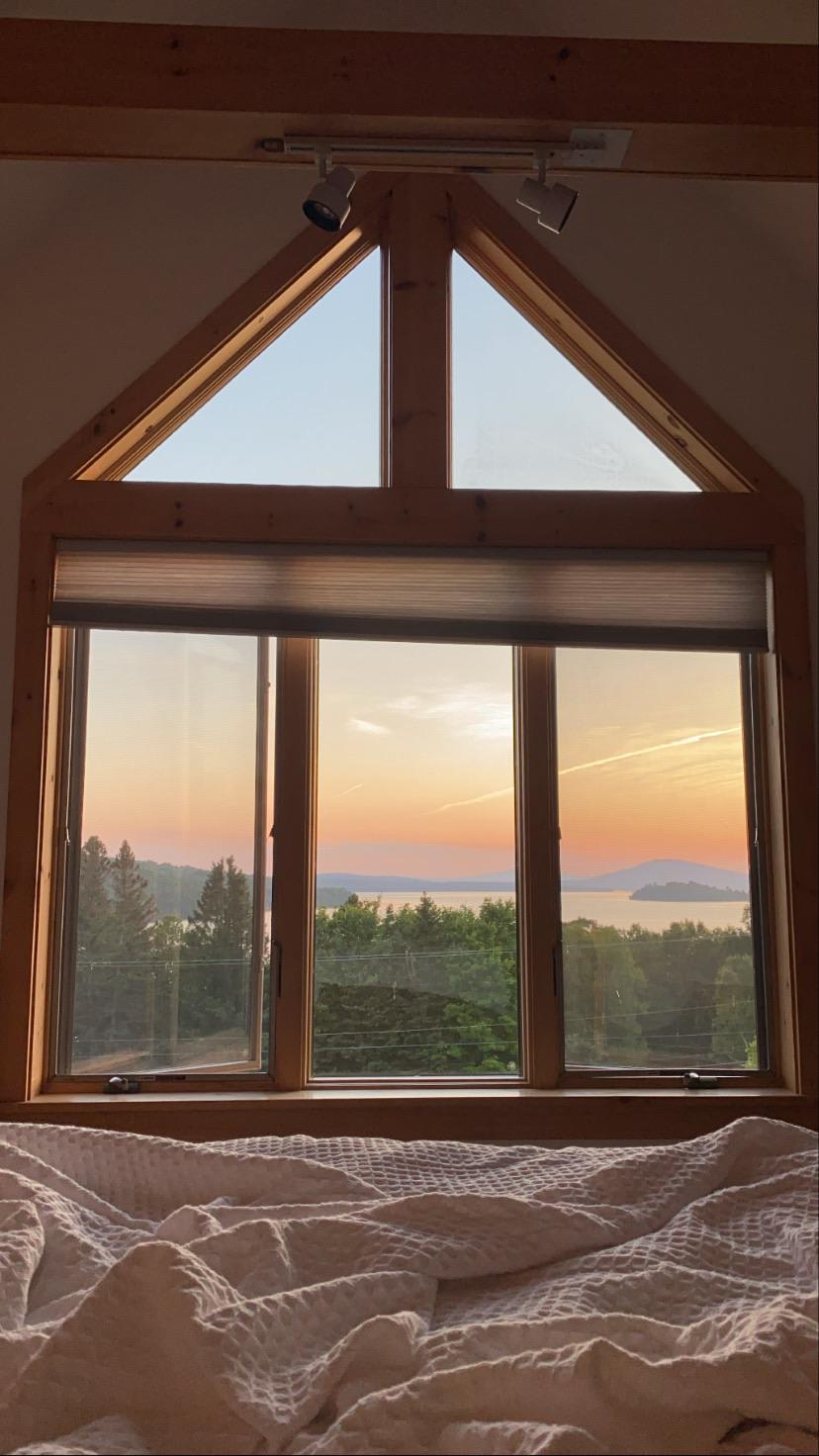 Watching the sunset from bed at a cabin I stayed at in Maine