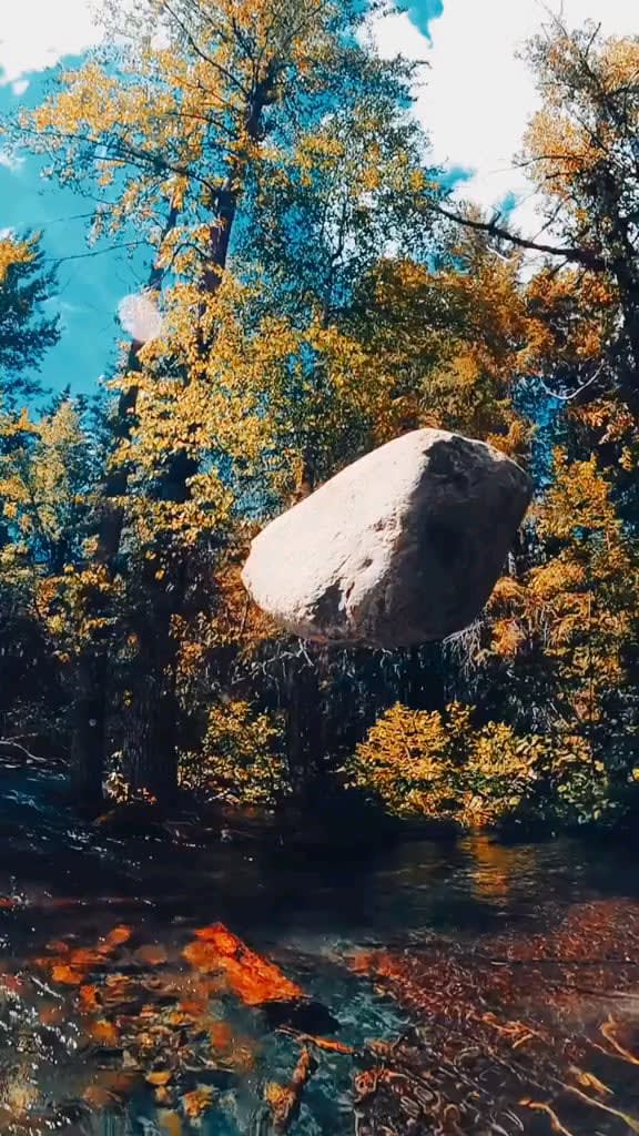 Majestic rock dropping into crystal clear water