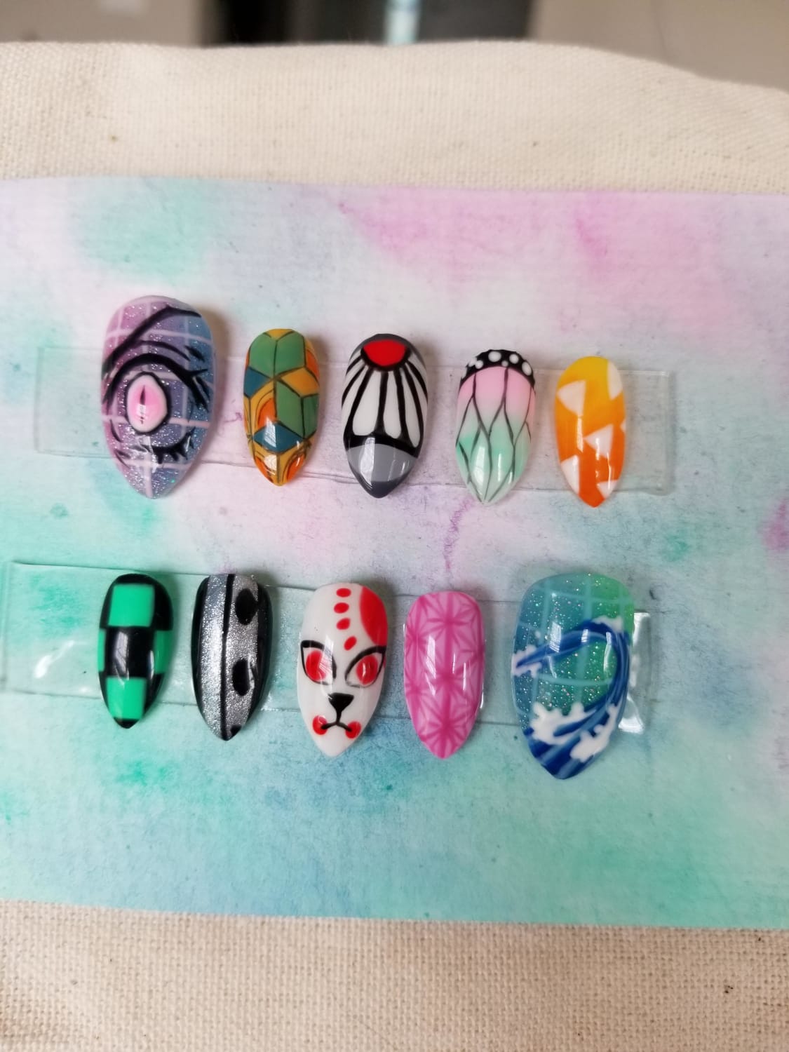 I completed my first set of press ons for my friend! She wanted Demon Slayer nails. These took me an unreasonable amount of time 😂