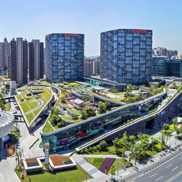 the greenland center by nikken sekkei forms shanghai's largest urban park