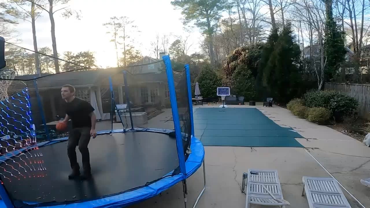 40yr old Dad makes a 58 foot mid backflip shot from trampoline to pool hoop
