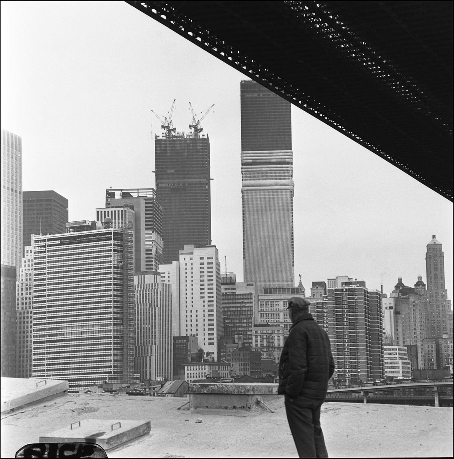 World Trade Center Under Construction, seen from below the Brooklyn Bridge, 1971. Photo by Paul Rice