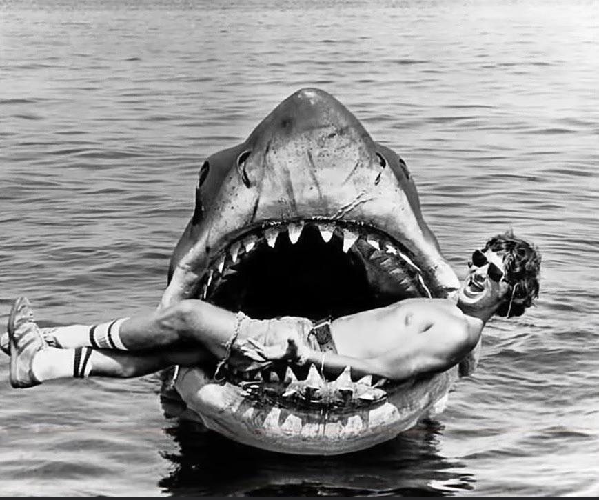 Steven Spielberg in the mouth of the shark they used in the hit movie “JAWS”