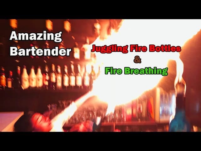 Amazing bartender juggling fire bottles and Fire Breathing skills