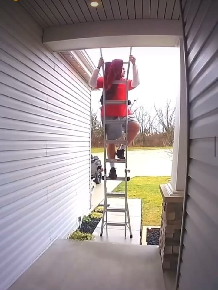 Adjusting a ladder while still on it