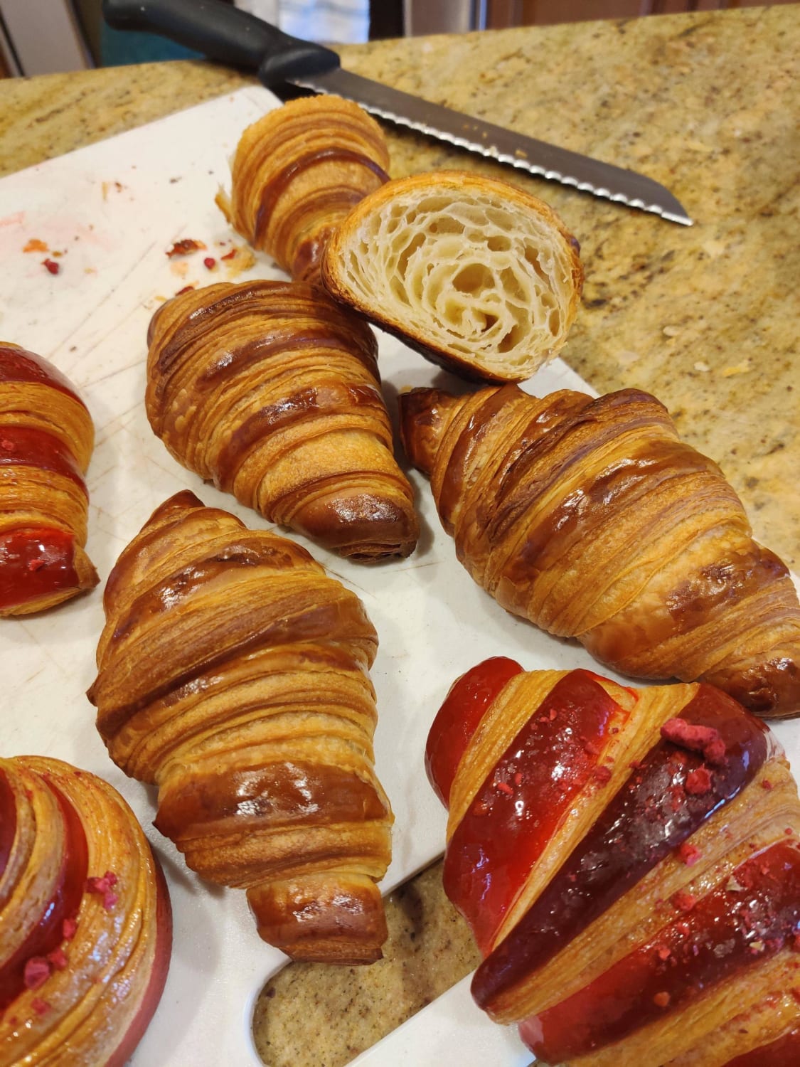 Some croissants I made today. The red ones are filled with rose-lychee cream and raspberry jam!