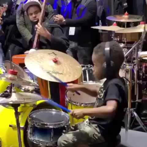 Young boy goes off on a drum solo
