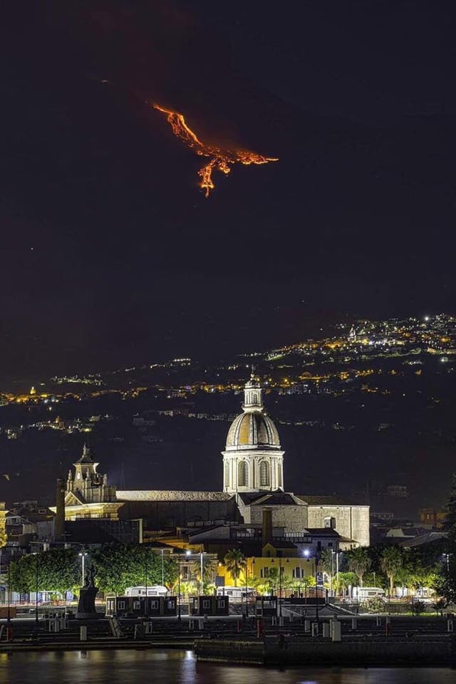 Eruption on Mount Etna (Sicily) gives the illusion of a Phoenix in the sky.