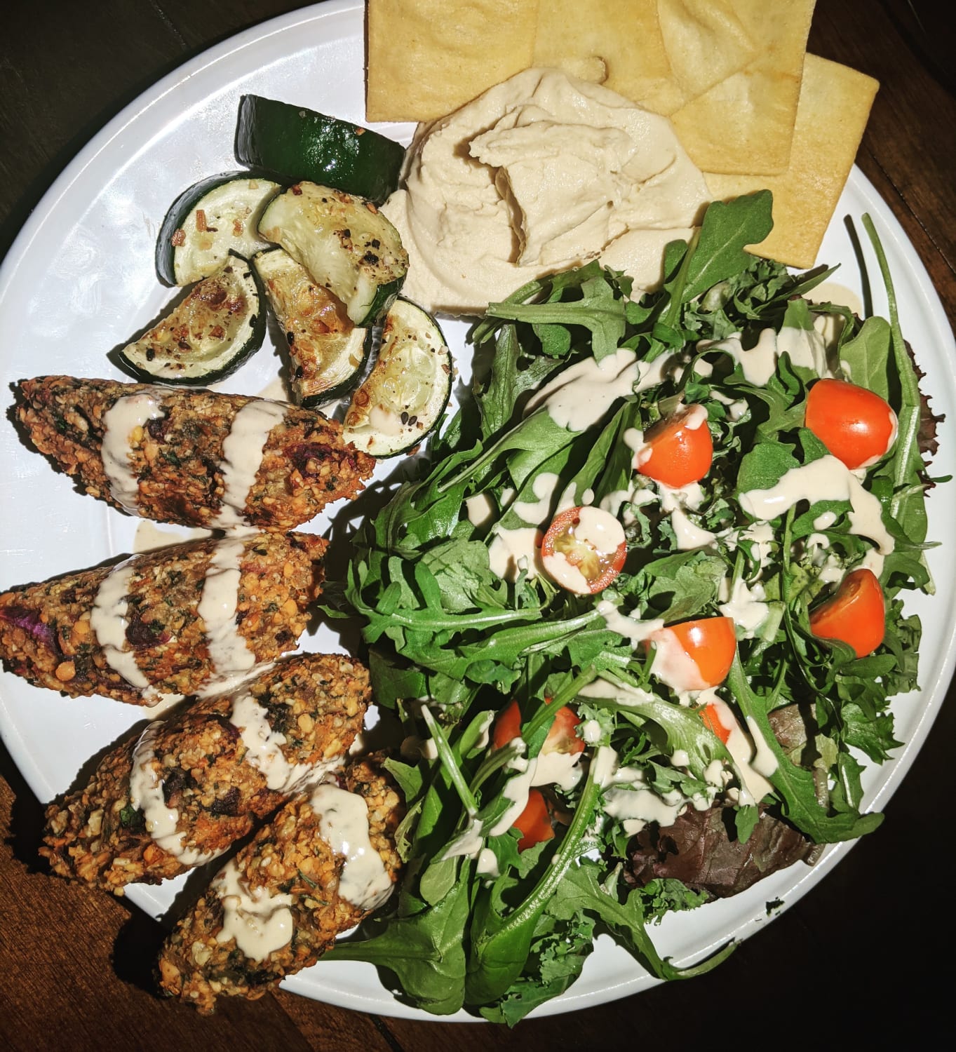 I slipped and had 3 pita chips, still wanted to share these amazing red lentil kabobs, roasted zucchini, home made hummus and salad with tahini/water dressing. Recipe linked in the comments