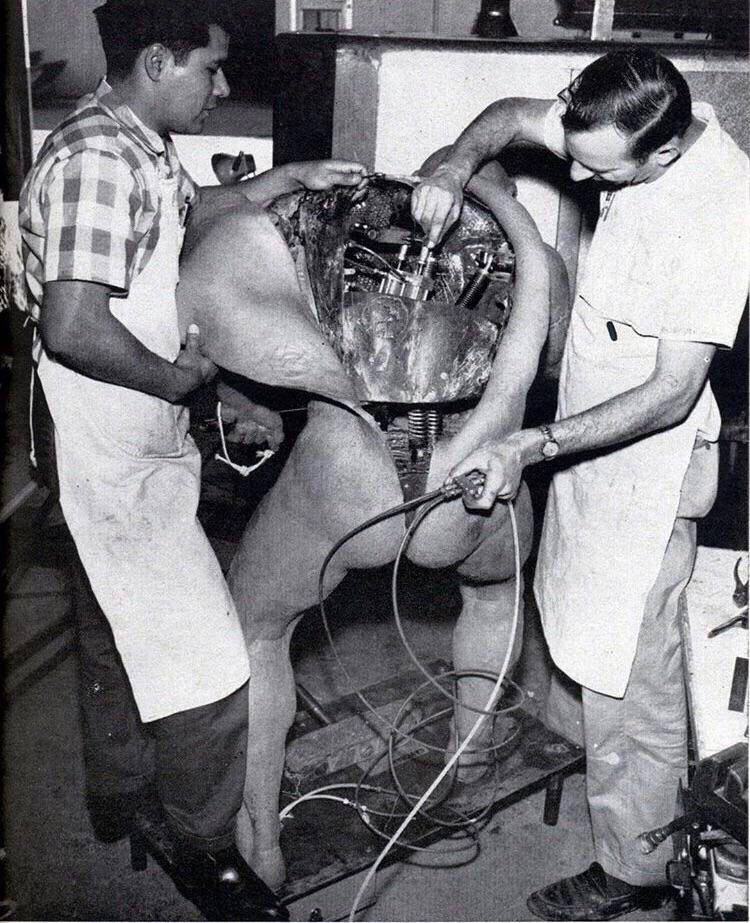 Disney technicians repairing an animatronic figure