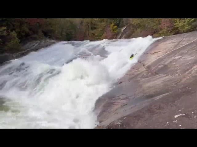 Kayaker Slids Through Steep Rapids - 1284614