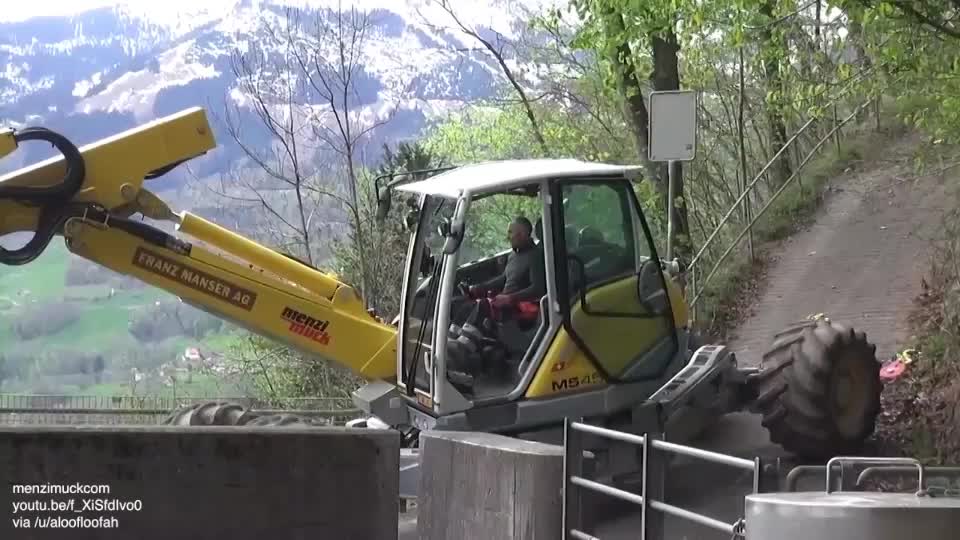 Walking excavator crawls to the bottom of a reservoir to clear the blockage