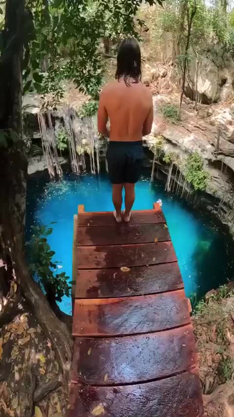 Back flipping into the cenotes of Cancún, Mexico