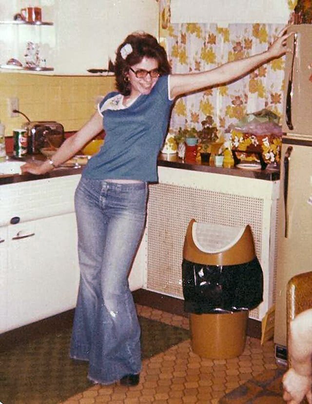 Looking fabulous. A mid 1970s teen posing in the kitchen in this Polaroid snapshot.