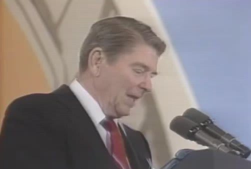 President Reagan reacts to a balloon popping during his speech in 1987