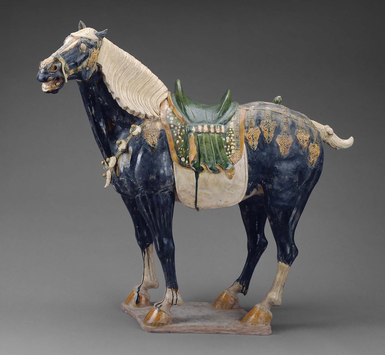 A Chinese ceramic horse, glazed, with applied motifs. Tang Dynasty, from the early 8th century. Detail pic in comment. Museum of Fine Art.