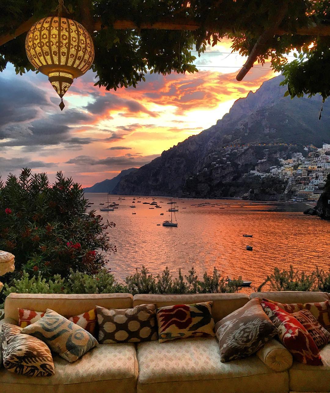 Positano and the Amalfi Coast seen from a shaded terrace, Campania, Italy.