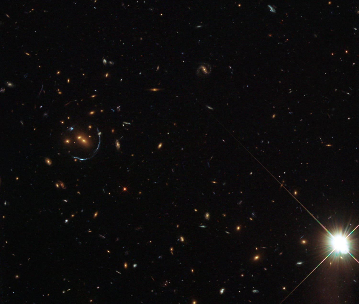 LRG-4-606, and a gravitational lens of an even more distant galaxy. LRG is the acronym given to a catalog of Luminous Red Galaxies found in the Sloan Digital Sky Survey (SDSS). These are mostly really massive elliptical galaxies full of huge numbers of old stars. (Image:NASA/Hubble)