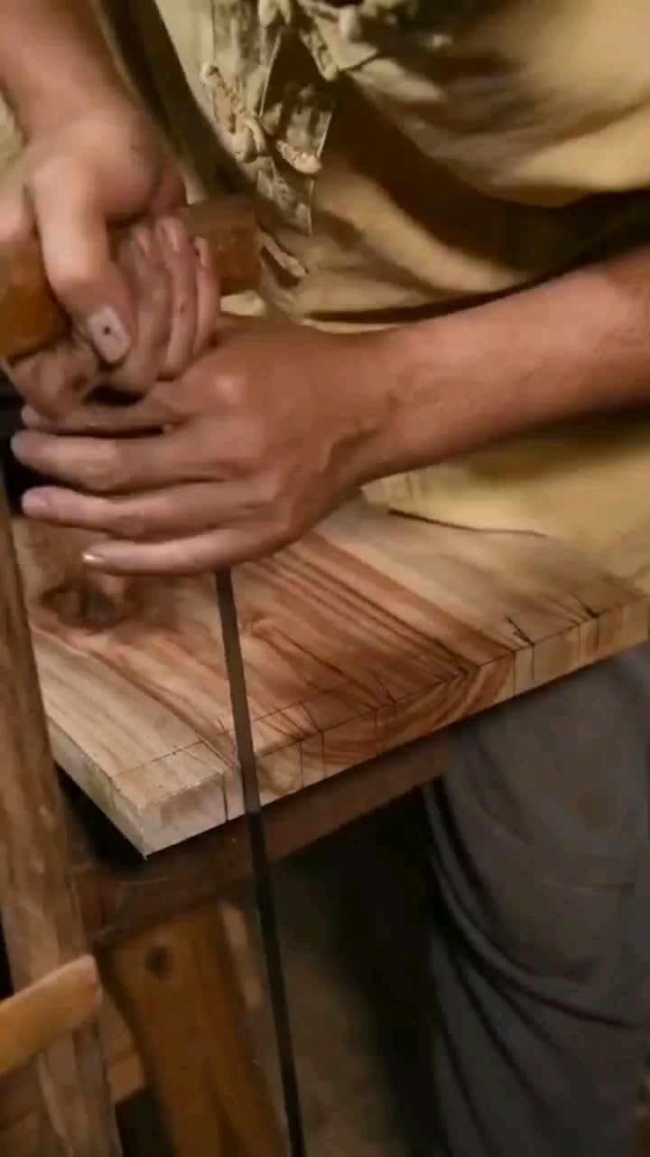 Skilled woodworker doesn't let a piece of rotten wood from the outside go to waste. He uses it to incorporate it into a hand crafted piece of furniture. He also builds it without the use of a single nail in the process.