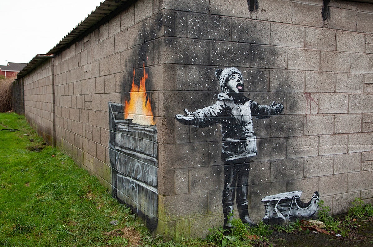 A Nostalgic Winter Scene Takes a Sinister Turn in a New Welsh Work by Banksy — Colossal
