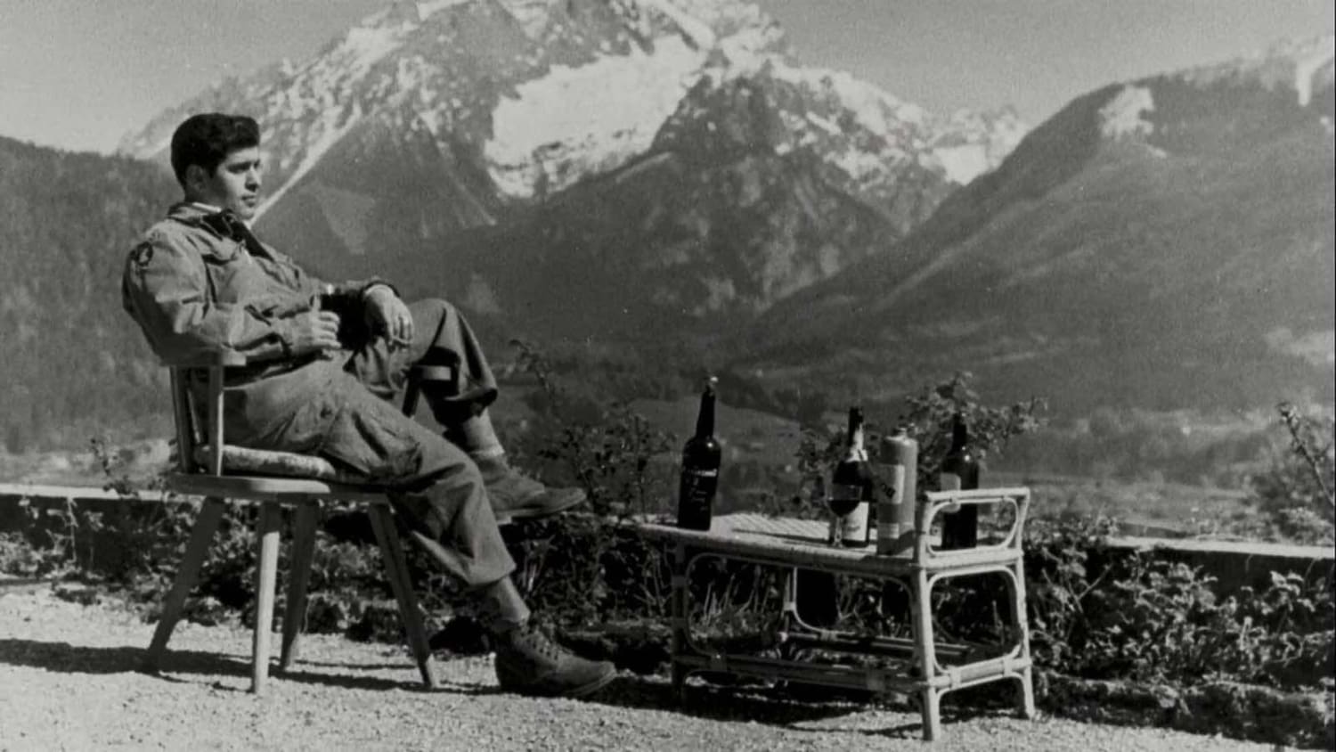 A paratrooper of the 101st Airborne Division enjoying the view and a cognac while lounging on the terrace of Hitler’s retreat at Berchtesgaden after the end of the war. Taken in May 1945
