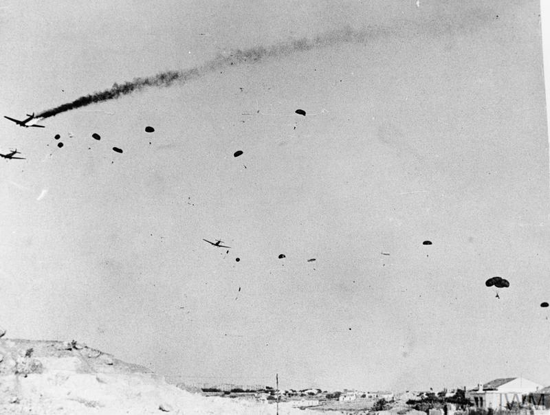German paratroops descend from Ju 52s during the invasion of Crete onthisday in 1941. Smoke streams from one of the transports that has been hit by machine gun fire. Find out more about the invasion: https://t.co/fvRuNkuKjm © IWM A4154