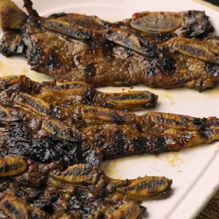 Succulent Korean-Style Short Ribs get coated in a marinade of sake, soy sauce, sugar, garlic and more, before being finished off on the grill: