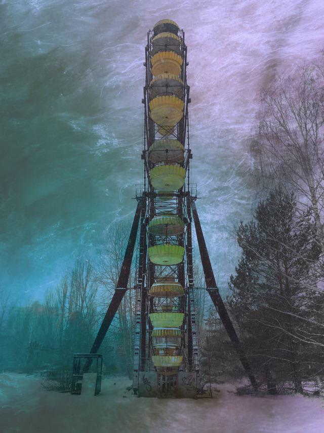 Abandoned Ferris wheel of the city of Pripyat during a blizzard.
