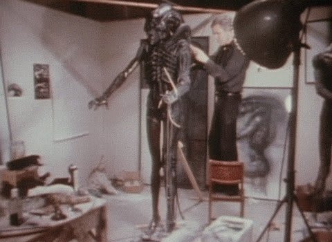 Artist H.R. Giger sculpting his Xenomorph