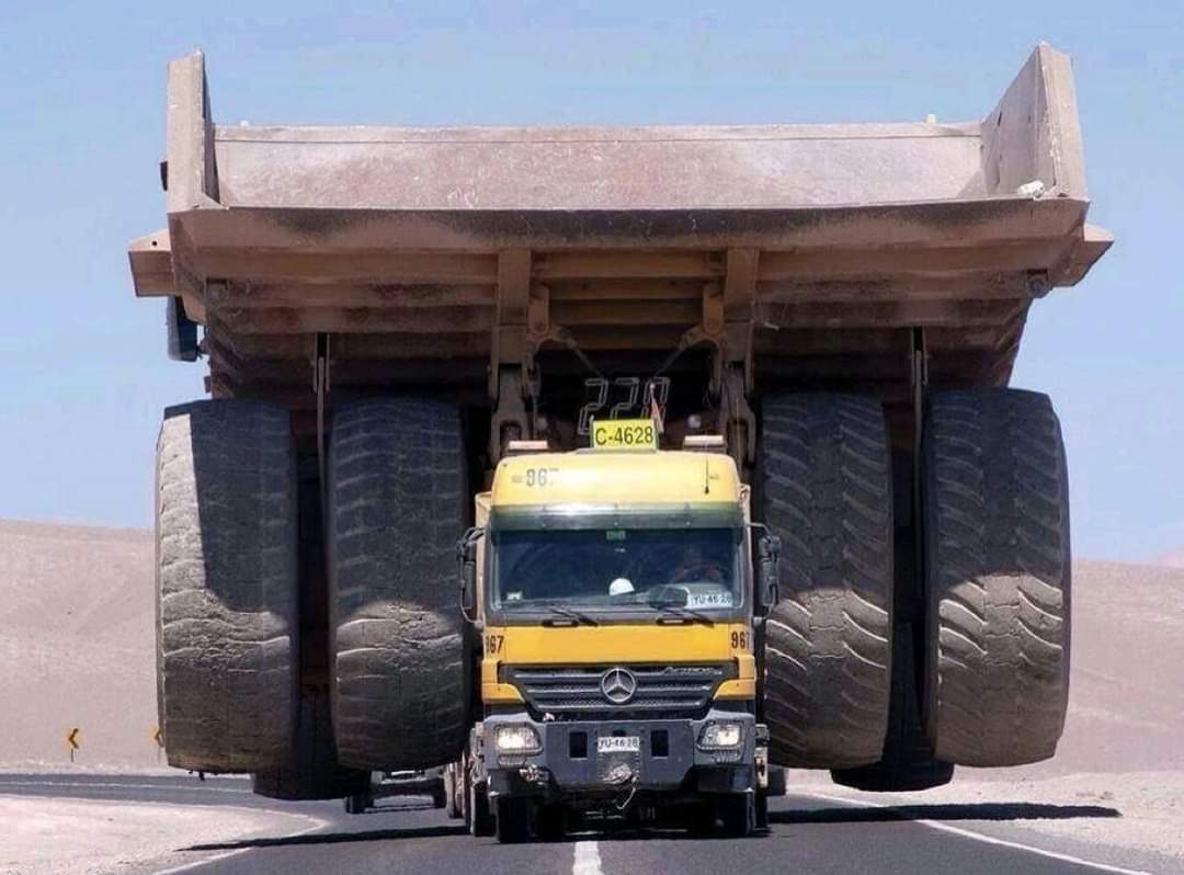 A Mercedes-Benz Actros truck hauling a Caterpillar 797 giant mining truck which weighs 240 Tons