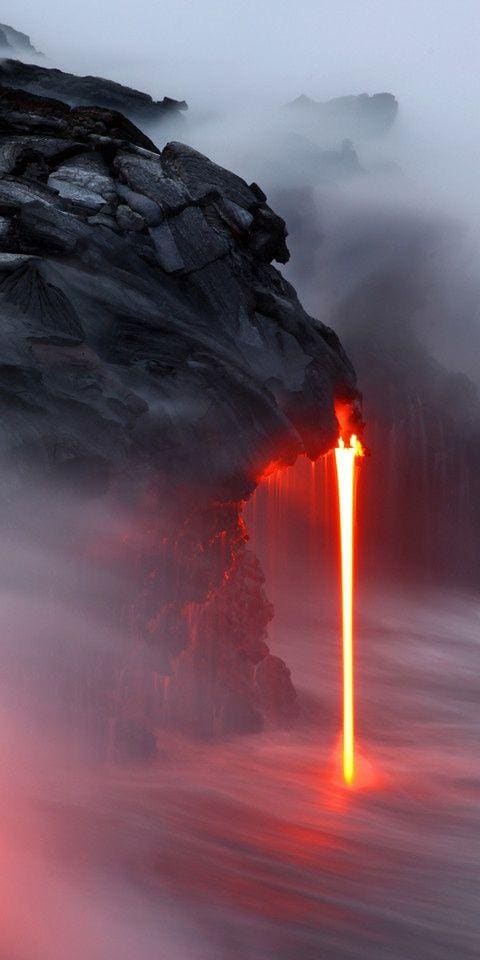 Lava flowing out of the Kilauea volcano into the ocean.