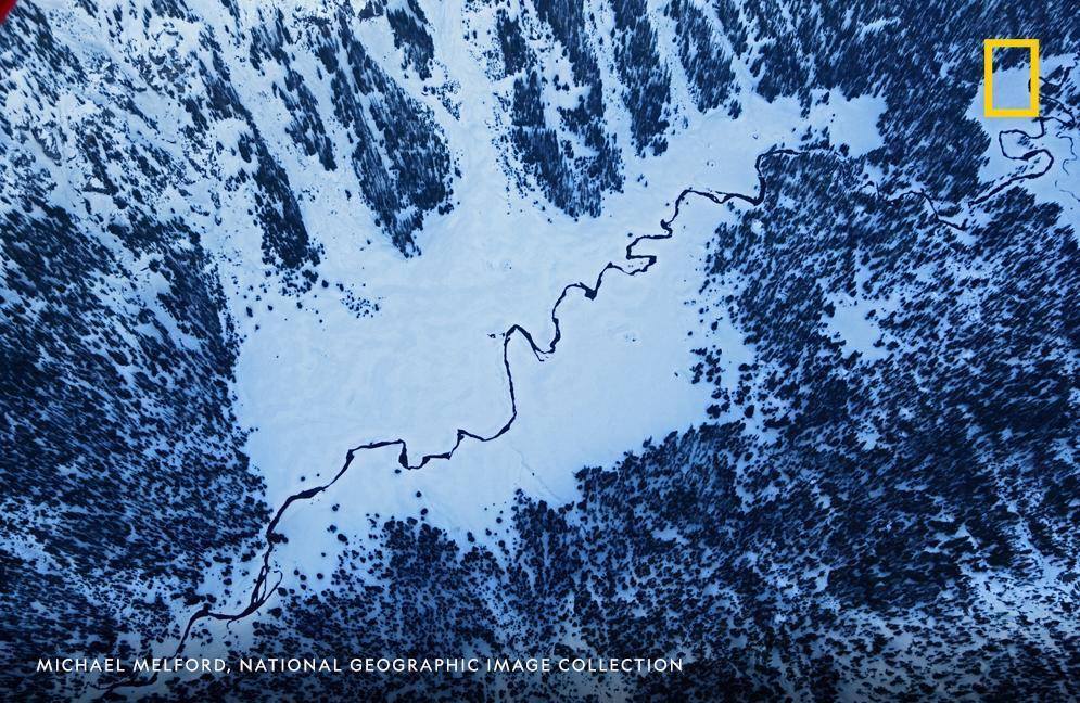 Melting snow reveals the Buffalo Fork of the Snake River in this image captured by photographer Michael Melford in Bridger-Teton National Forest, Wyoming.