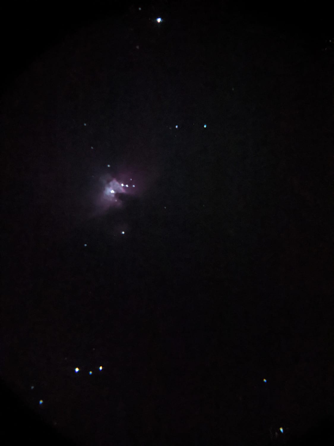 Shitty phone picture of the orion nebula last night through my new scope