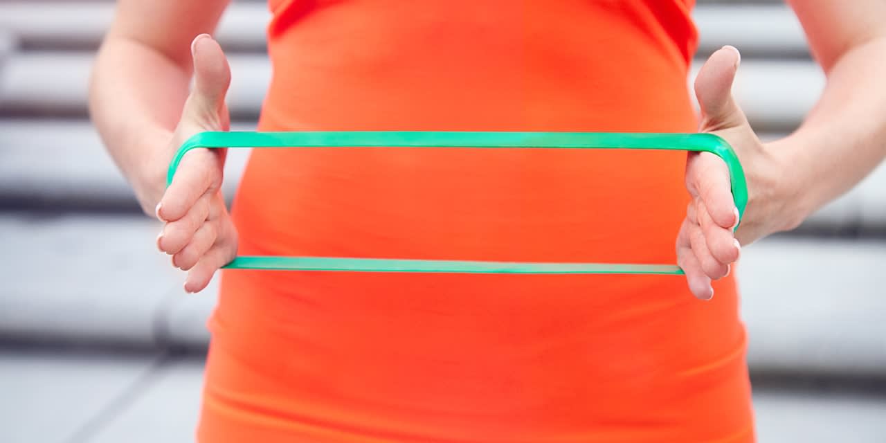 Why You Should Try Sit-ups With a Mini Resistance Band Around Your Wrists
