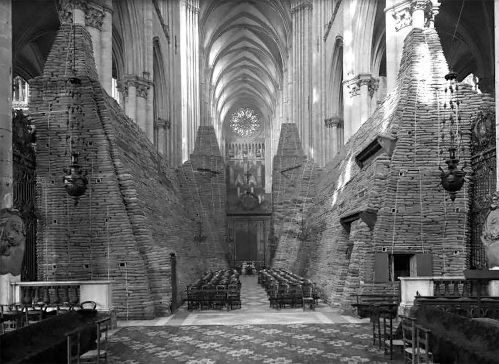 Notre Dame surrounded by sandbags, inside and out, during World War One, 1917.