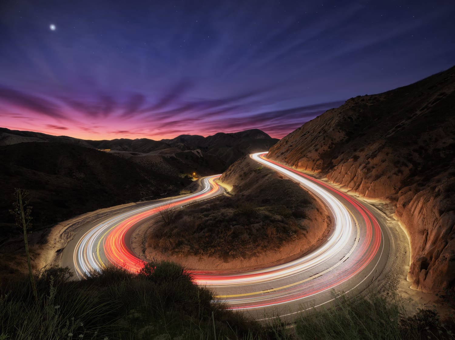 The bustle of cars driving through Grimmes Canyon, CA