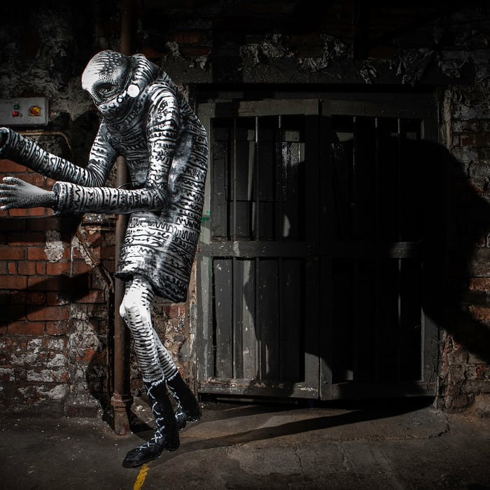 Monochrome Monsters Squeeze into a Former Factory in a New Monumental Exhibition by Phlegm