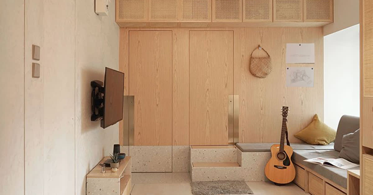 absence from island completes apartment interior in hong kong with rattan, wood + terrazzo