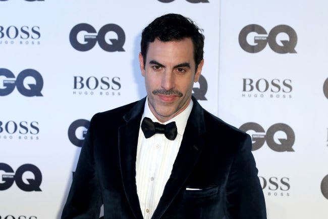 Sacha Baron Cohen Crashes Far-Right Rally and Dupes Attendees with Racist Singalong