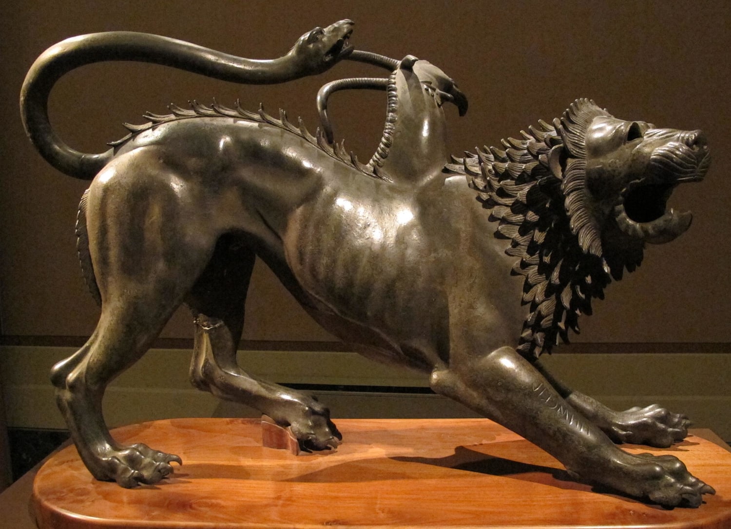 Etruscan bronze statue of the legendary monster, Chimera. Discovered at Arezzo, Tuscany and dated to ca. 400 BC. On the right leg is engraved a dedicatory inscription to Tinia. Length: 129 cm (50.7 in). National Archaeological Museum, Florence.