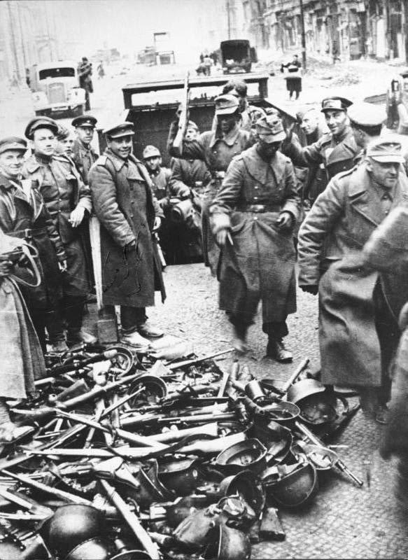 German soldiers come out of the subway and surrender their weapons at the end of the battle of Berlin. May 1945