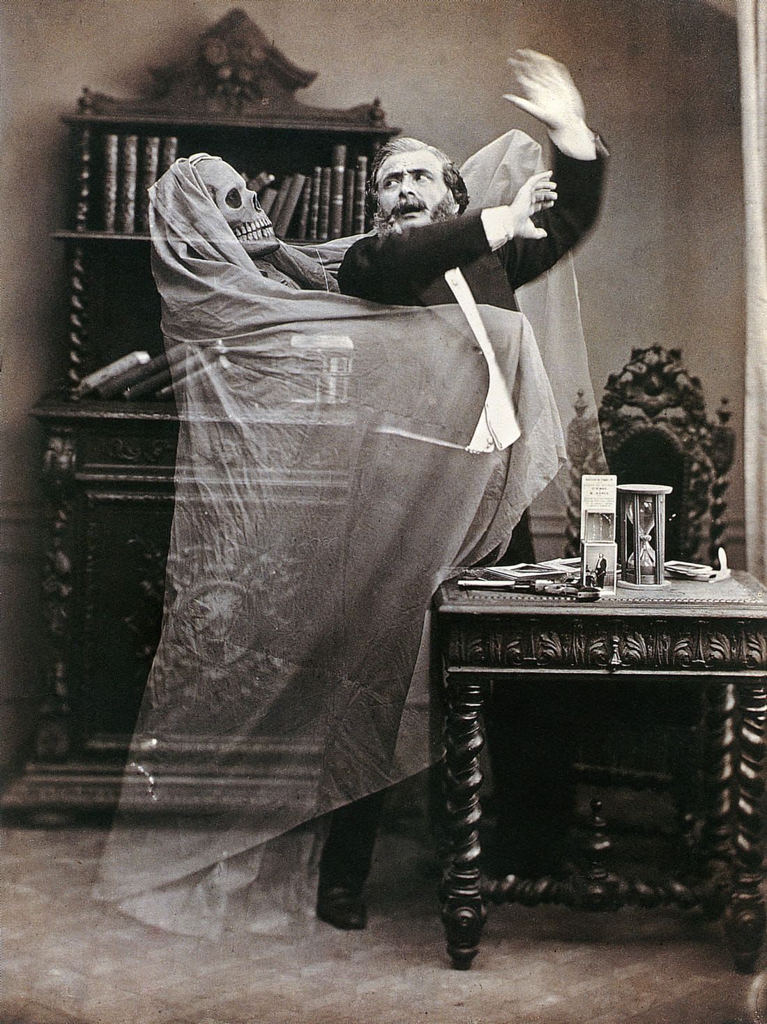 Double-exposed photograph of French illusionist Henri Robin with a ghost, by Eugène Thiébault, 1863