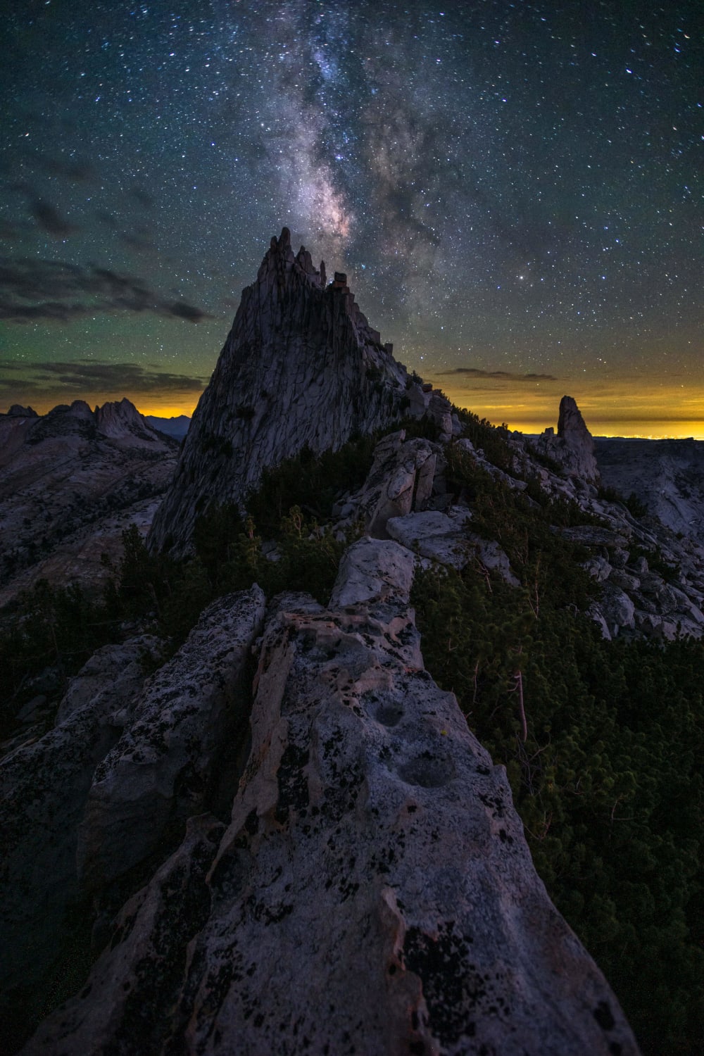 I tried to capture this last year but smoke from nearby fires blocked the entire vista. When July rolled around this year I knew exactly where I would be. Milky Way gleaming over Cathedral Peak, Yosemite National Park