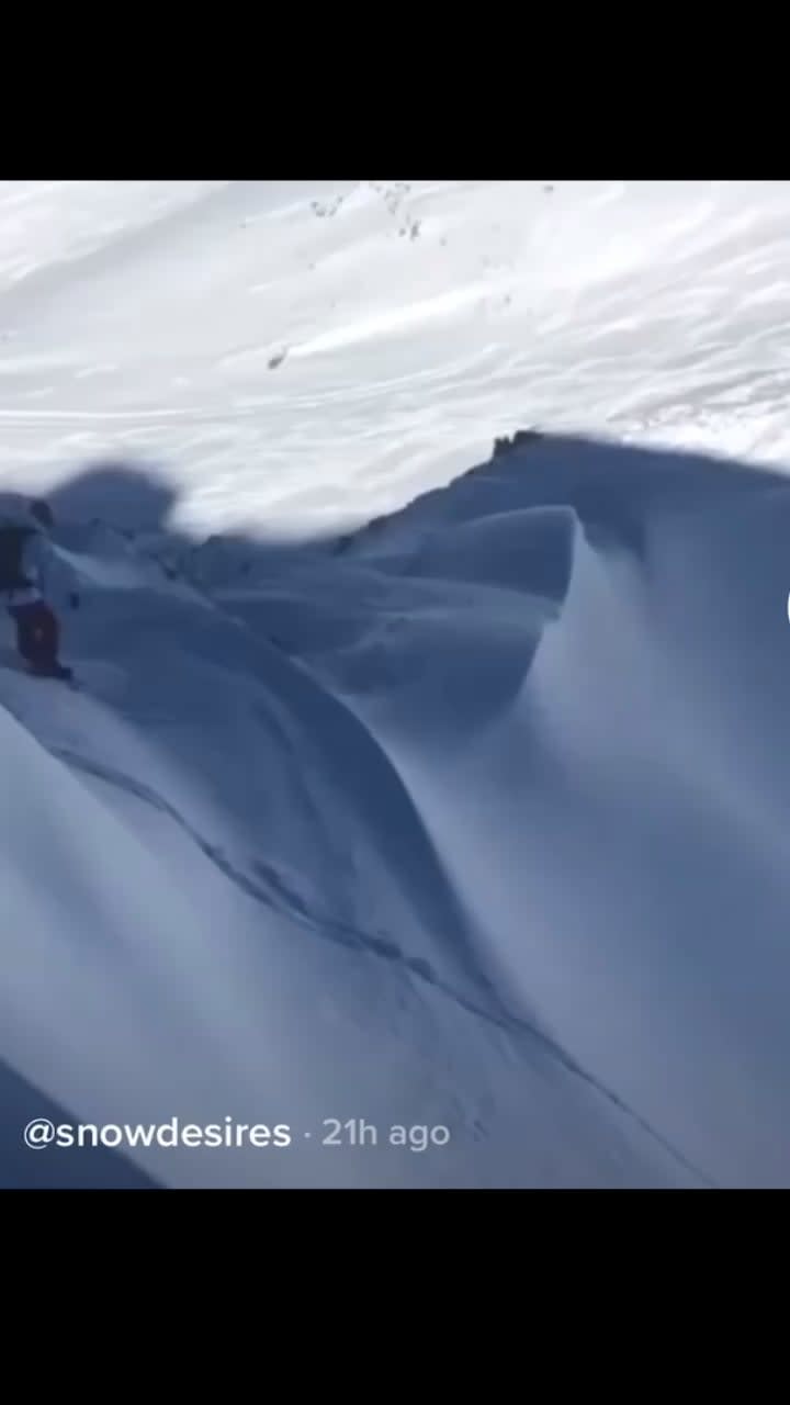 Snowboarder barely escapes the grips of a deadly avalanche