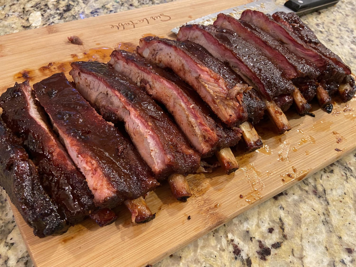 St. Louis ribs smoked with cherry wood and lump. Finished them off with a mango glaze