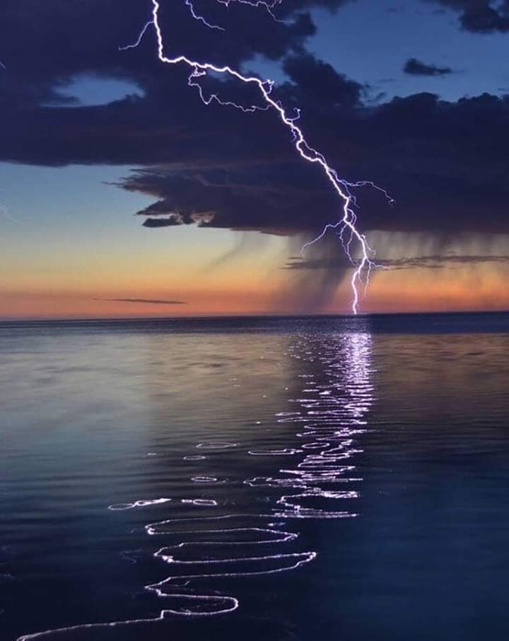 Lightning reflecting on the water