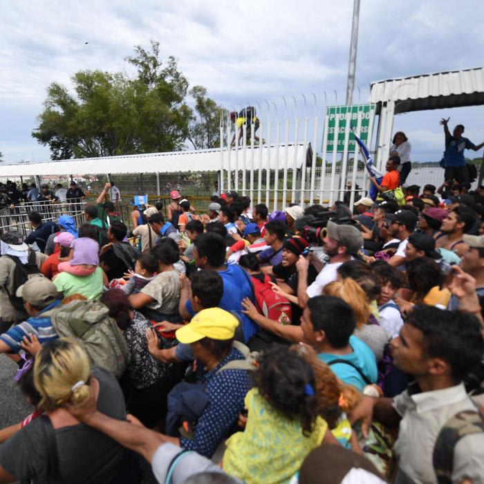 Migrant Caravan Breaks Through Guatemala's Border Fence and Rushes Into Mexico