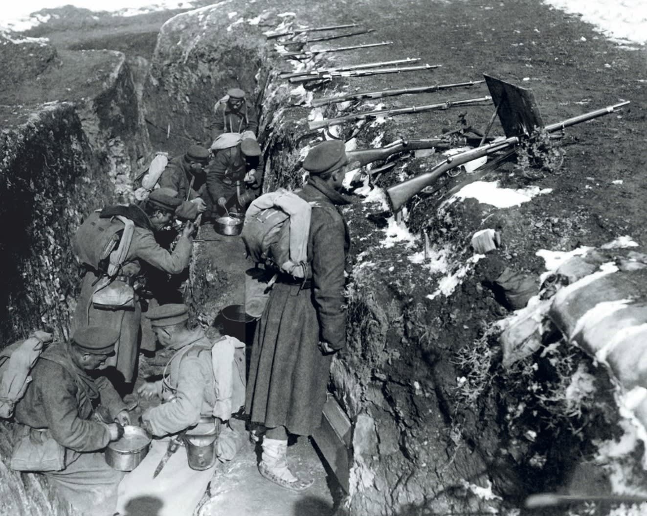 Bulgarian soldiers eating a meal in their trench in the Doiran area of the Salonikan front, also known as the Macedonian front, 1917. .