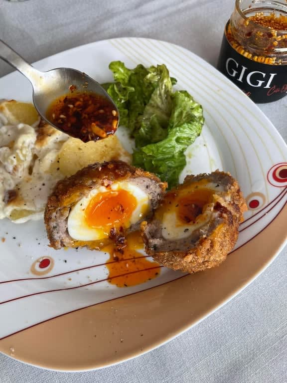 Scotch eggs, first time! Also, my homemade chili oil