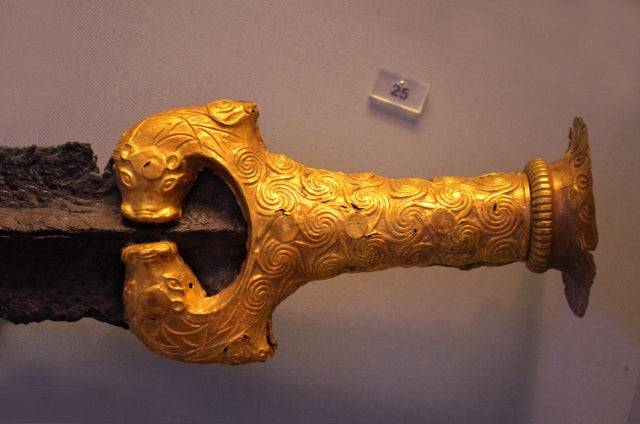 1600's BC: Gold Hilt of a Mycenaean Sword, adorned with lions. Crete.